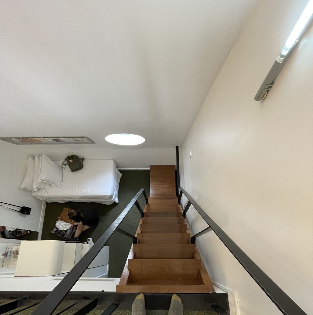 looking down the loft stairs to first floor of the triple room