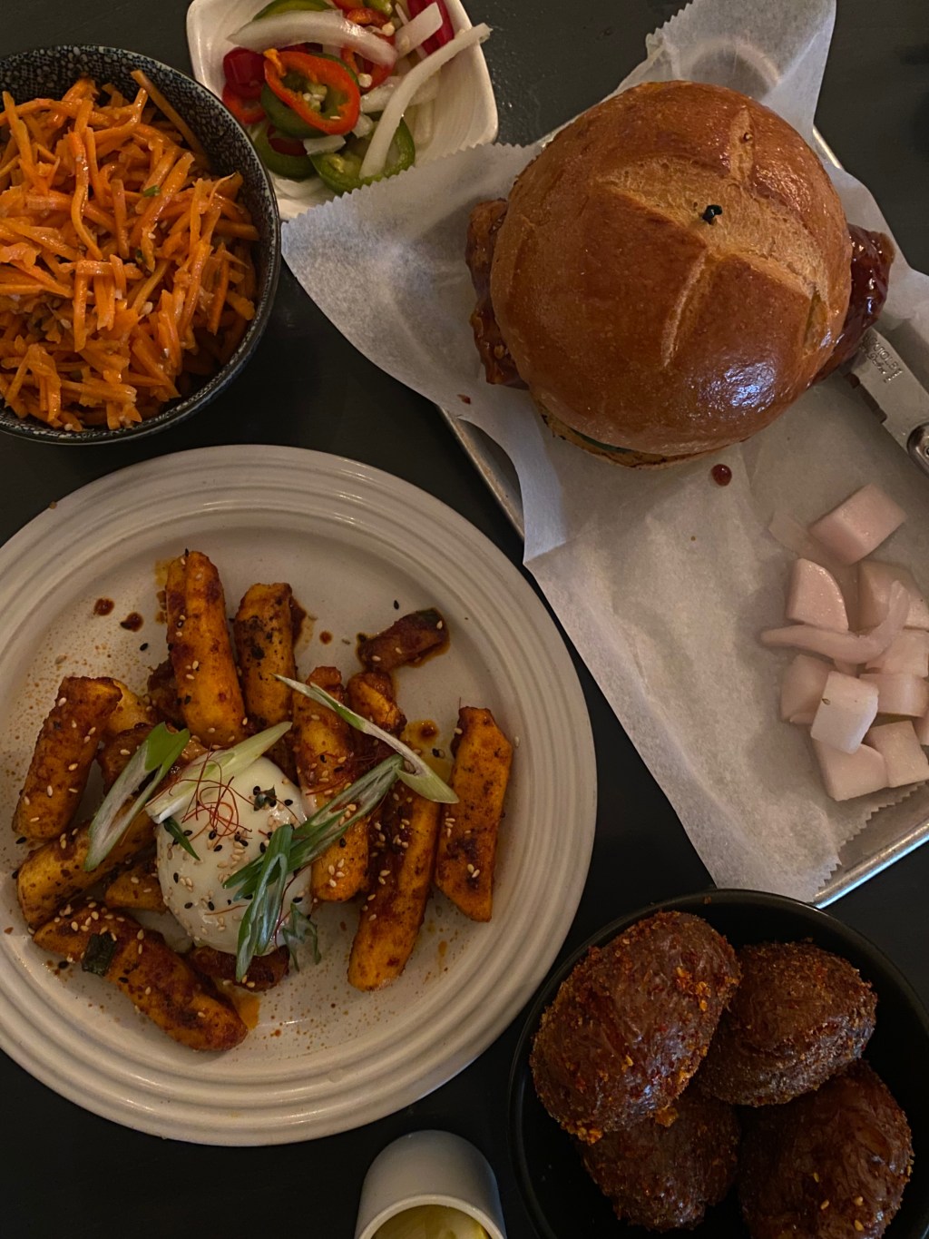 Miss Kim tteokbokki (street style), mashed potatoes, carrot salad, and the chili glaze chicken sandwich.